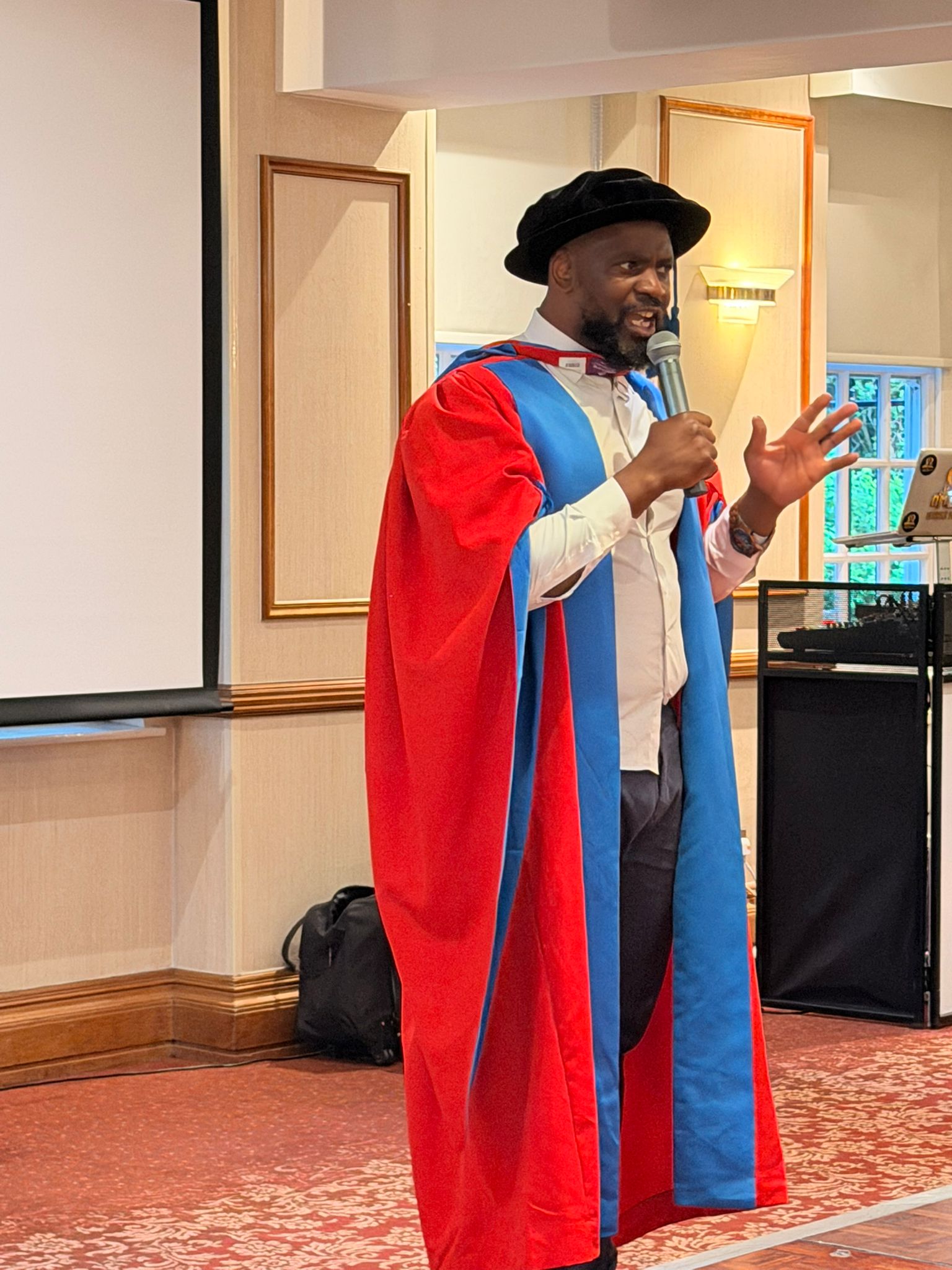 Dr Patrick Jolomba speaking at a public engagement event